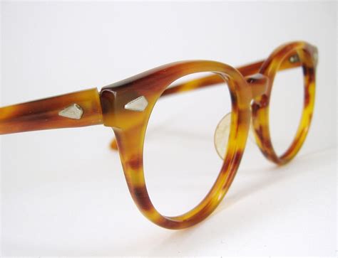 Glasses with Tortoise Frames .